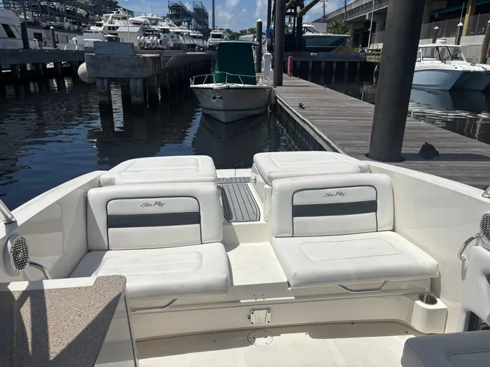  Yacht Photos Pics 2014 Sea Ray 300 SLX boat interior with white seating at a marina dock.