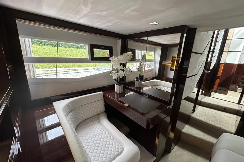 Bugsy Yacht Photos Pics Luxurious interior of 2020 Galeon 550 Fly yacht with elegant seating and decor.