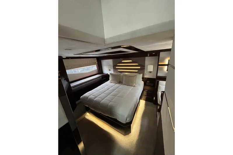 Bugsy Yacht Photos Pics Luxurious bedroom interior of 2020 Galeon 550 Fly yacht with modern lighting and cozy bedding.