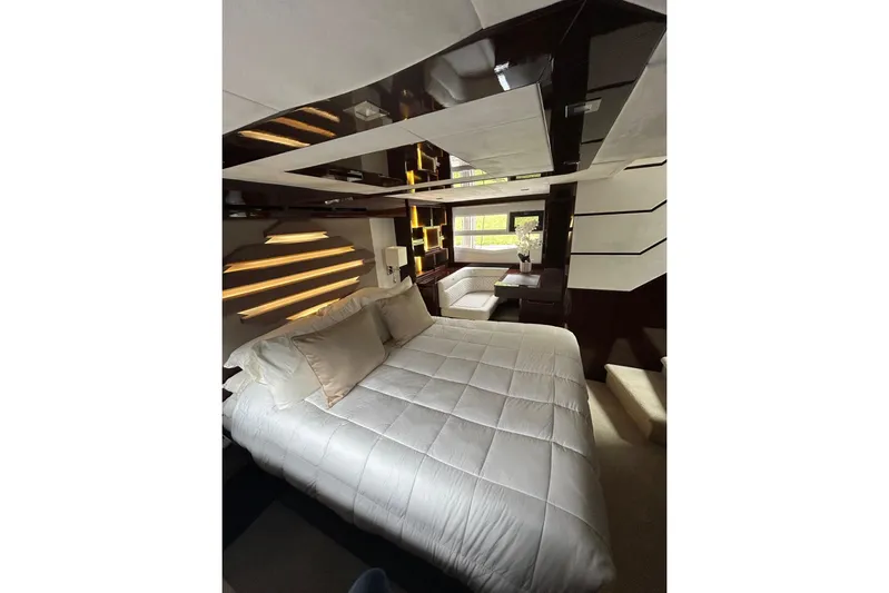 Bugsy Yacht Photos Pics Luxurious bedroom interior of 2020 Galeon 550 Fly yacht with modern design and ambient lighting.