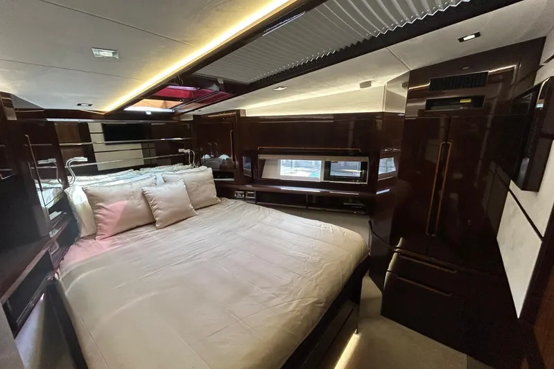 Bugsy Yacht Photos Pics Luxurious bedroom interior of 2020 Galeon 550 Fly yacht with modern design and ambient lighting.