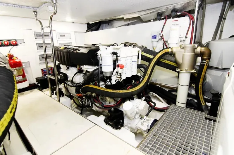 Bugsy Yacht Photos Pics Engine room of 2020 Galeon 550 Fly yacht, featuring complex machinery and fire safety equipment.