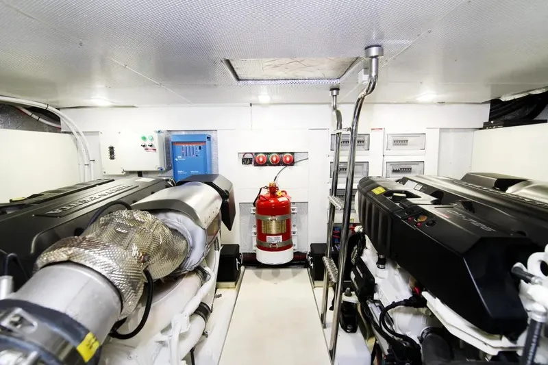 Bugsy Yacht Photos Pics Engine room of 2020 Galeon 550 Fly yacht, featuring dual engines and safety equipment.
