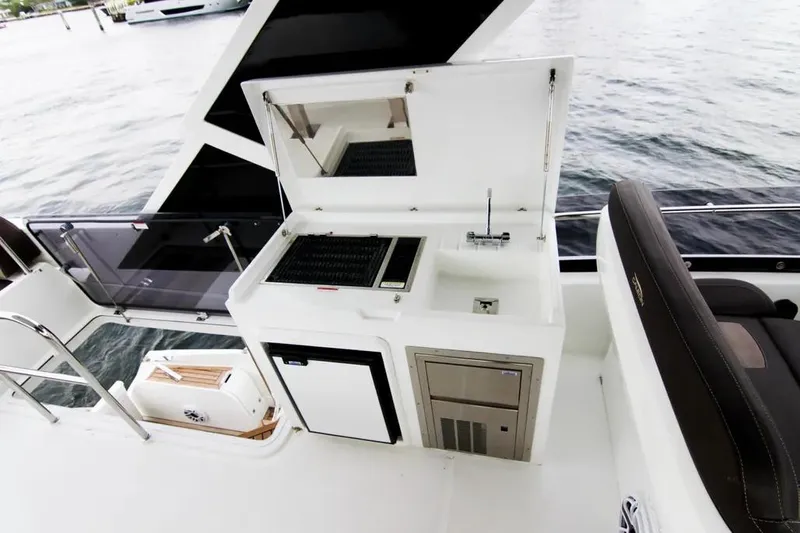 Bugsy Yacht Photos Pics Outdoor kitchen on 2020 Galeon 550 Fly yacht with grill and sink by the water.