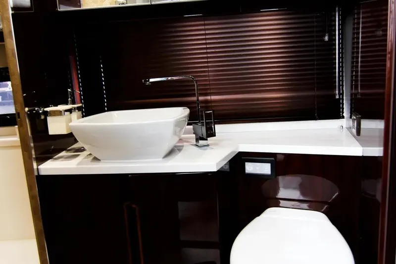 Bugsy Yacht Photos Pics Luxurious bathroom interior of 2020 Galeon 550 Fly yacht with modern sink and toilet.