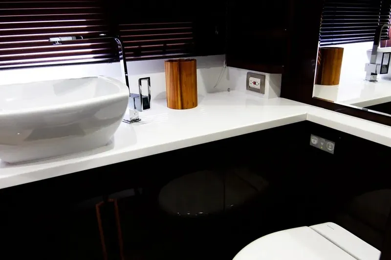 Bugsy Yacht Photos Pics Modern bathroom interior on 2020 Galeon 550 Fly yacht, featuring sleek sink and fixtures.