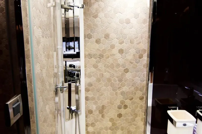 Bugsy Yacht Photos Pics Luxurious bathroom in 2020 Galeon 550 Fly yacht with hexagonal tile design.