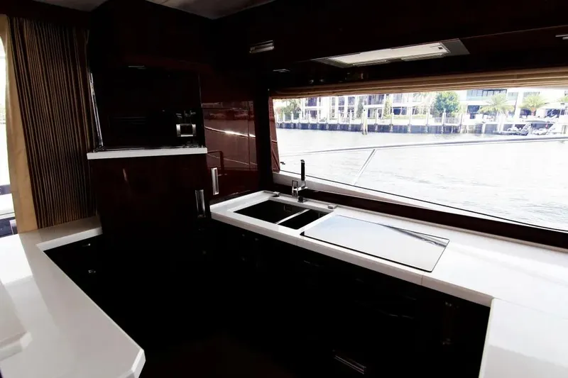Bugsy Yacht Photos Pics Luxurious kitchen interior of 2020 Galeon 550 Fly yacht with waterfront view.