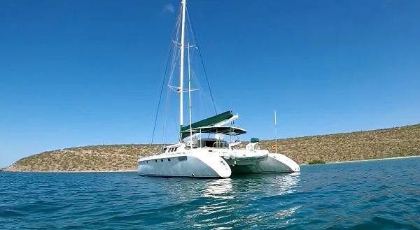  Yacht Photos Pics Fountaine Pajot Marquises 56 catamaran sailing on clear blue water, 1997 model.