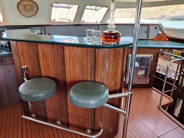  Yacht Photos Pics Luxurious interior of 1997 Fountaine Pajot Marquises 56 yacht with elegant bar and seating.