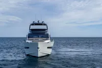 2023 Astondoa AS8 yacht on open sea under cloudy sky.