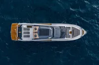 Aerial view of 2023 Astondoa AS8 yacht cruising on deep blue ocean waters.