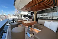 Luxurious 2023 Astondoa AS8 yacht deck with modern seating and wooden accents.
