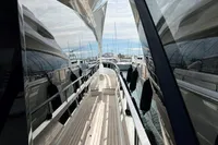 2023 Astondoa AS8 yacht with sleek design and modern features, docked at a marina.