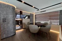 Luxurious interior of 2023 Astondoa AS8 yacht with modern dining area and elegant design.