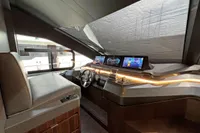 Luxurious 2023 Astondoa AS8 yacht cockpit with modern navigation displays and sleek design.