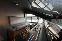 2023 Astondoa AS8 yacht interior with modern helm and seating area.
