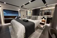 Luxurious bedroom interior of 2023 Astondoa AS8 yacht with modern design and elegant furnishings.