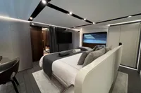 Luxurious bedroom interior of 2023 Astondoa AS8 yacht, featuring modern design and elegant furnishings.
