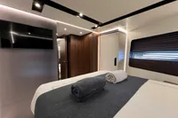 Luxurious bedroom interior of 2023 Astondoa AS8 yacht with modern design and elegant furnishings.