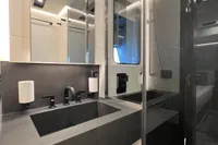 Luxurious bathroom in 2023 Astondoa AS8 yacht with sleek modern design and glass shower.