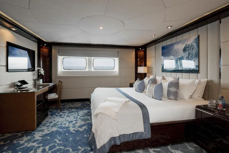 Dream Yacht Photos Pics Luxurious yacht bedroom with elegant decor, large bed, and ocean view windows. Abeking & Rasmussen 6430, 2001.