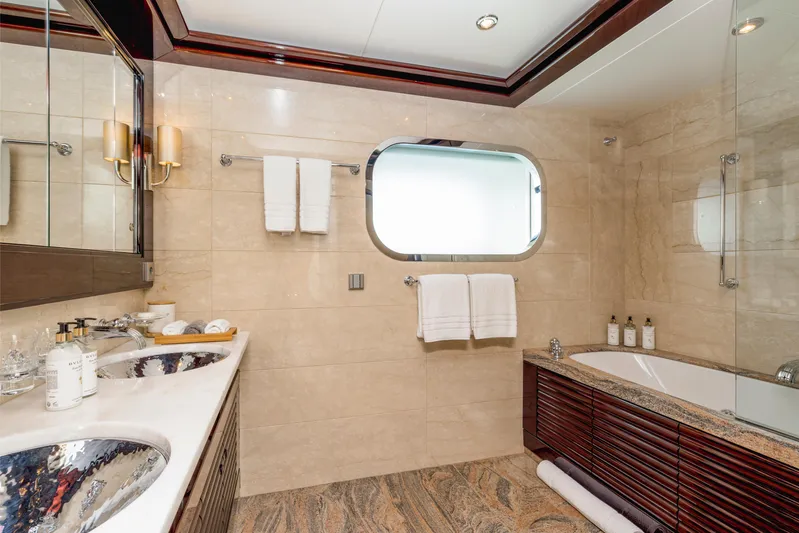 Dream Yacht Photos Pics Luxurious yacht bathroom with dual sinks, bathtub, and elegant fixtures, Abeking & Rasmussen 6430, 2001.