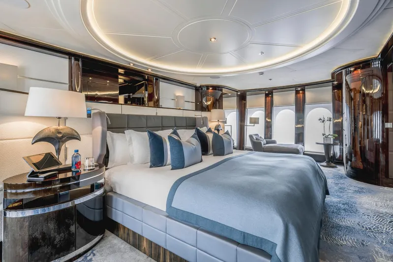 Dream Yacht Photos Pics Luxurious yacht bedroom with elegant decor, featuring a large bed and modern furnishings, Abeking & Rasmussen 6430.