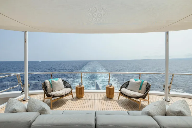 Dream Yacht Photos Pics Luxurious yacht deck with ocean view, featuring modern seating and elegant design, Abeking & Rasmussen 6430.