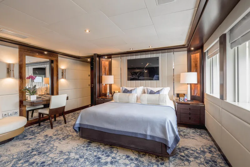 Dream Yacht Photos Pics Luxurious yacht bedroom interior with elegant decor, featuring a comfortable bed and stylish furnishings.