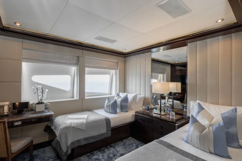 Dream Yacht Photos Pics Luxurious yacht bedroom with twin beds, elegant decor, and ocean view windows. Abeking & Rasmussen 6430, 2001.