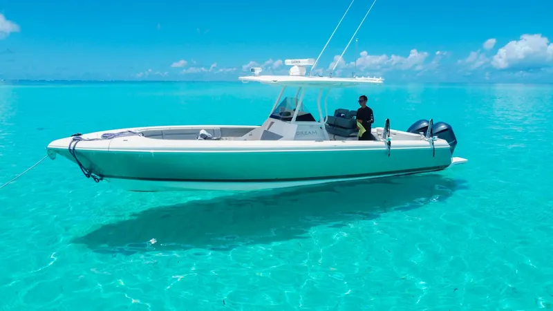 Dream Yacht Photos Pics A sleek Abeking & Rasmussen 6430 boat from 2001 on clear turquoise water.