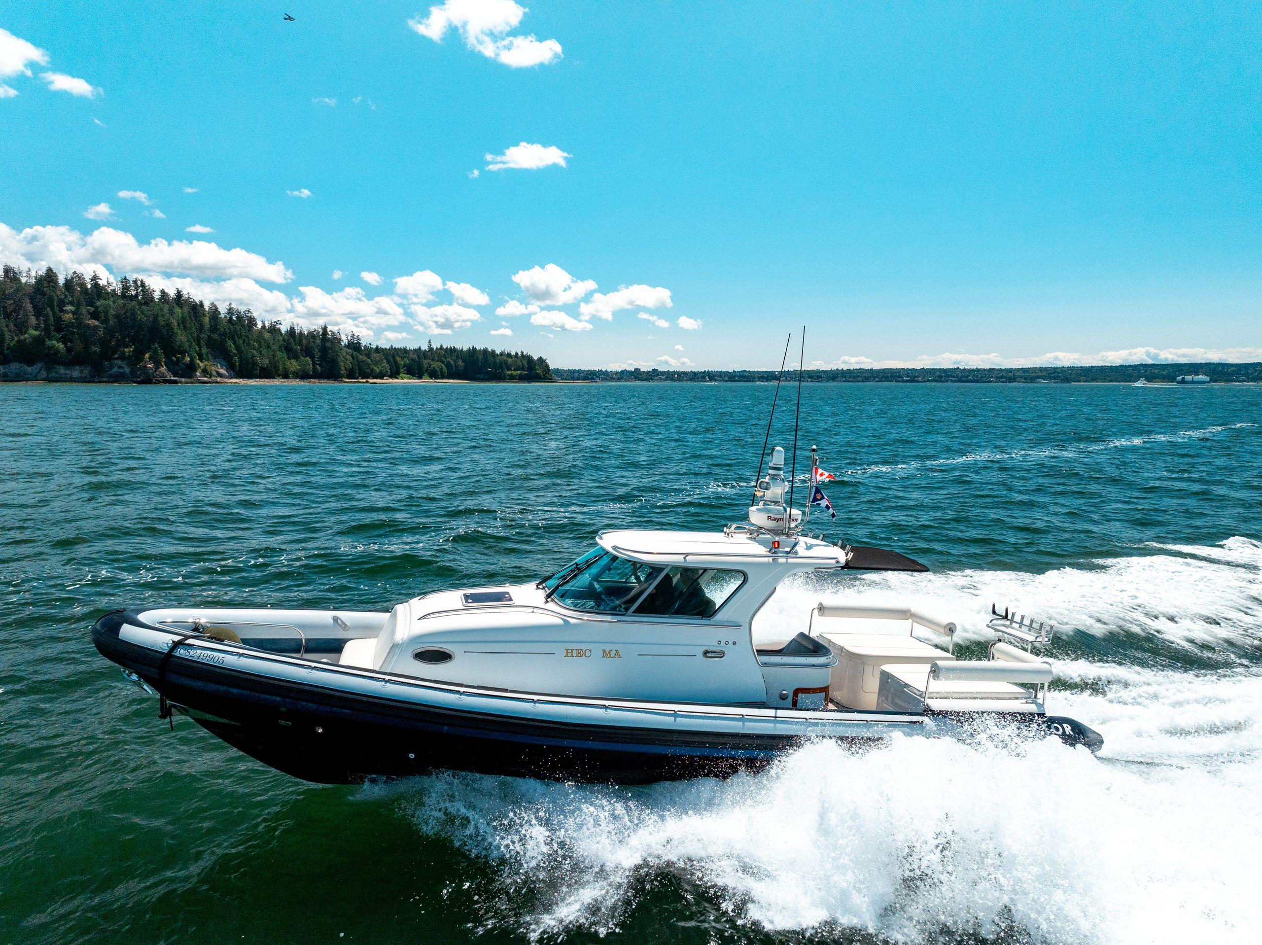 2009 Protector Targa 35 boat cruising on a sunny day in open water.