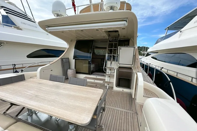  Yacht Photos Pics 2010 Abati Yachts 64 Freeport luxury yacht with spacious deck and elegant dining area.