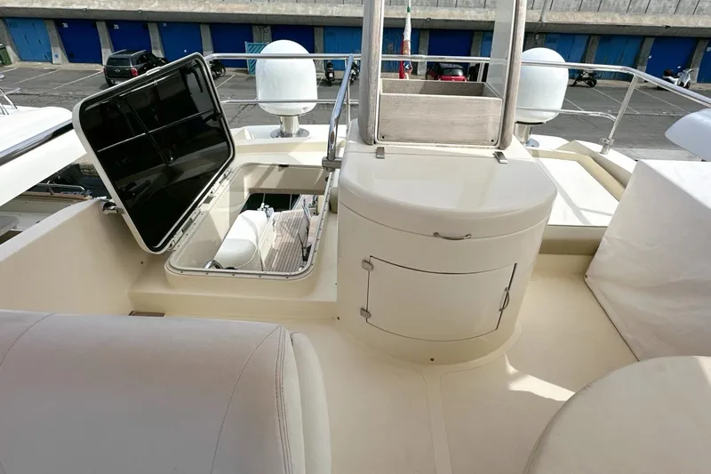  Yacht Photos Pics 2010 Abati Yachts 64 Freeport deck with open hatch and seating area.