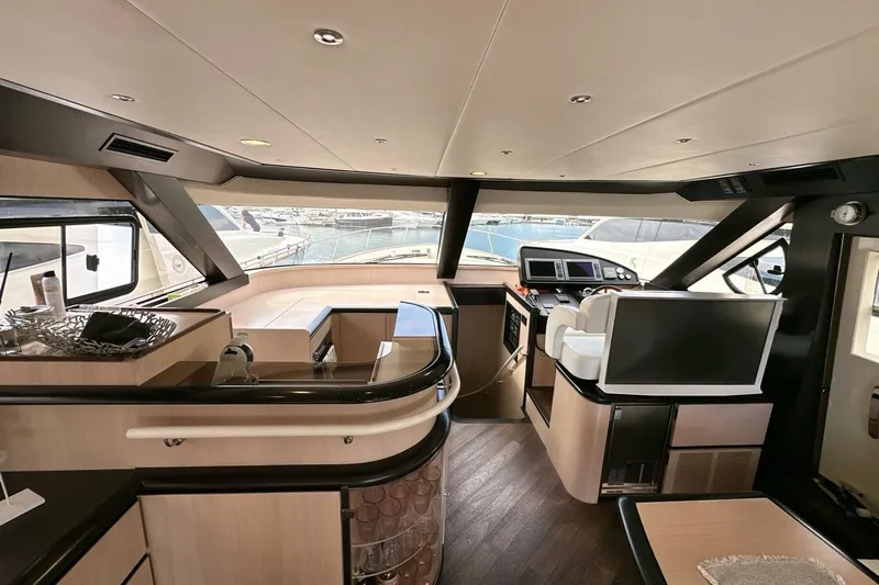  Yacht Photos Pics Luxurious interior of 2010 Abati Yachts 64 Freeport with modern helm and seating area.