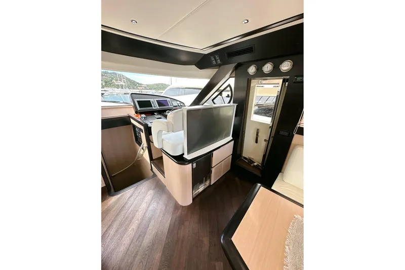  Yacht Photos Pics Interior of 2010 Abati Yachts 64 Freeport, featuring modern helm and navigation equipment.