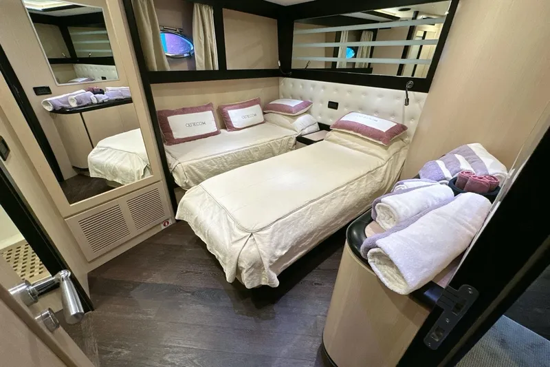  Yacht Photos Pics Luxurious cabin interior of 2010 Abati Yachts 64 Freeport with twin beds and elegant decor.