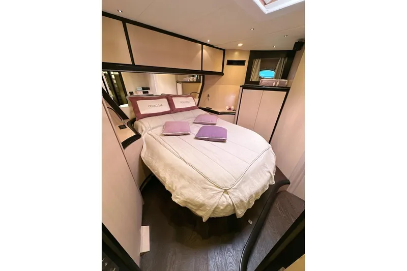  Yacht Photos Pics Luxurious bedroom interior of 2010 Abati Yachts 64 Freeport with elegant bedding and modern design.