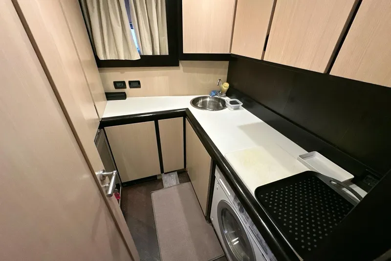  Yacht Photos Pics Compact kitchen area in 2010 Abati Yachts 64 Freeport with modern amenities.