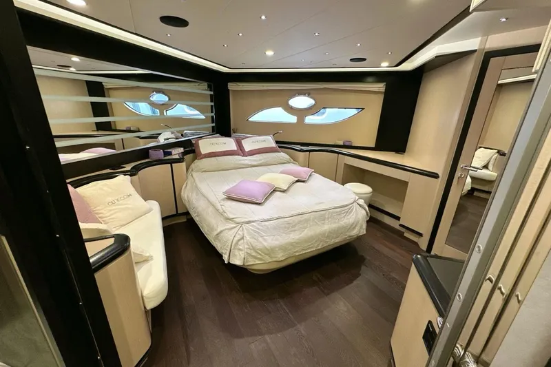  Yacht Photos Pics Luxurious bedroom interior of 2010 Abati Yachts 64 Freeport with modern design and elegant furnishings.