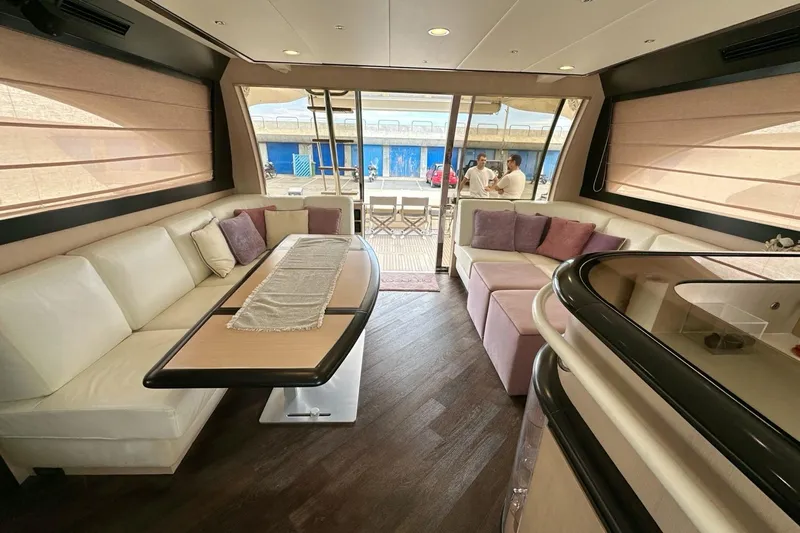  Yacht Photos Pics Luxurious interior of 2010 Abati Yachts 64 Freeport with elegant seating and dining area.