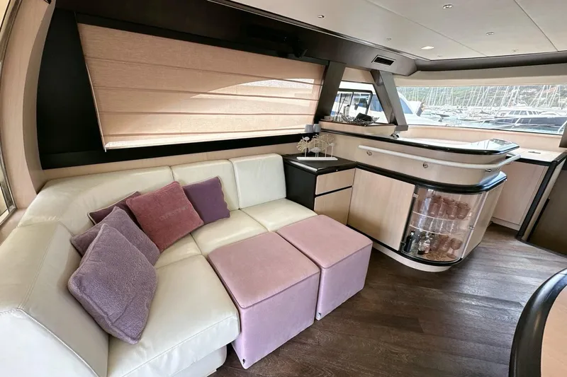  Yacht Photos Pics Luxurious interior of 2010 Abati Yachts 64 Freeport with plush seating and elegant bar area.