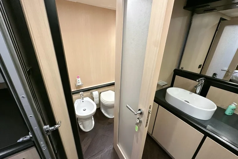  Yacht Photos Pics Luxurious bathroom in 2010 Abati Yachts 64 Freeport, featuring modern fixtures and elegant design.