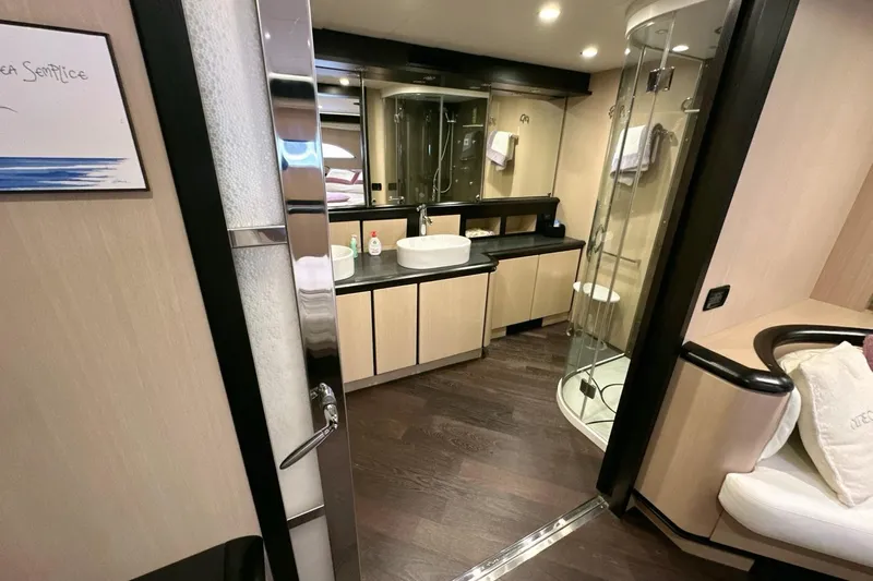  Yacht Photos Pics Luxurious bathroom interior of 2010 Abati Yachts 64 Freeport with modern fixtures and elegant design.