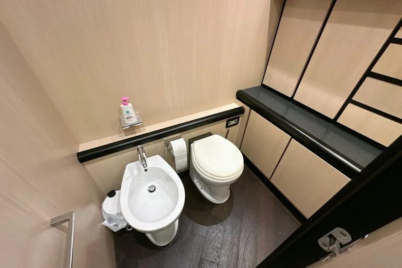  Yacht Photos Pics Luxurious bathroom on 2010 Abati Yachts 64 Freeport, featuring modern fixtures and elegant cabinetry.