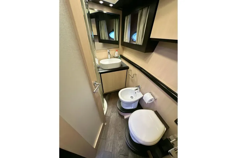  Yacht Photos Pics Luxurious bathroom in 2010 Abati Yachts 64 Freeport, featuring modern fixtures and elegant design.