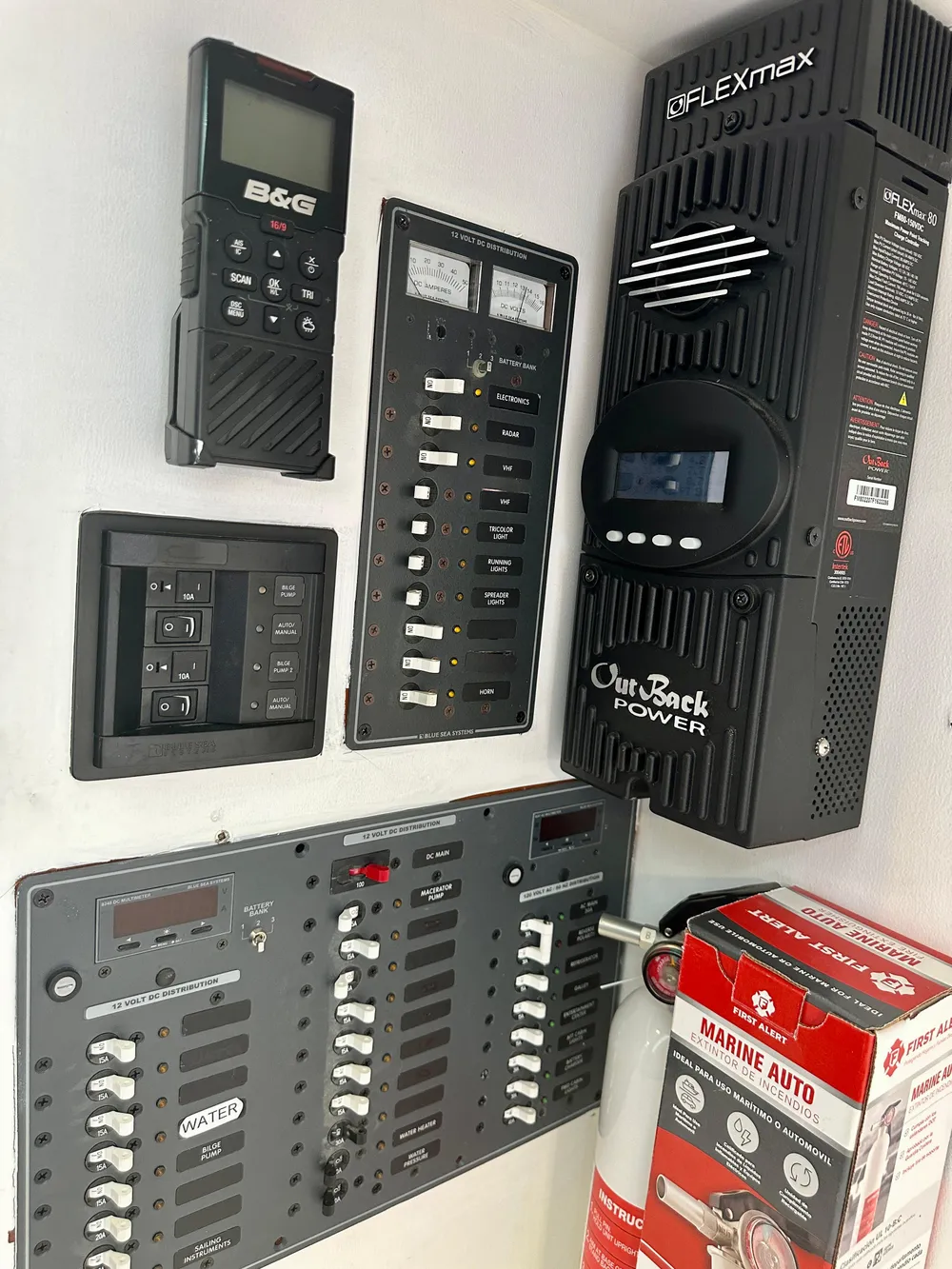 Electrical control panel on a 1983 Tayana 55 yacht with various switches and devices.