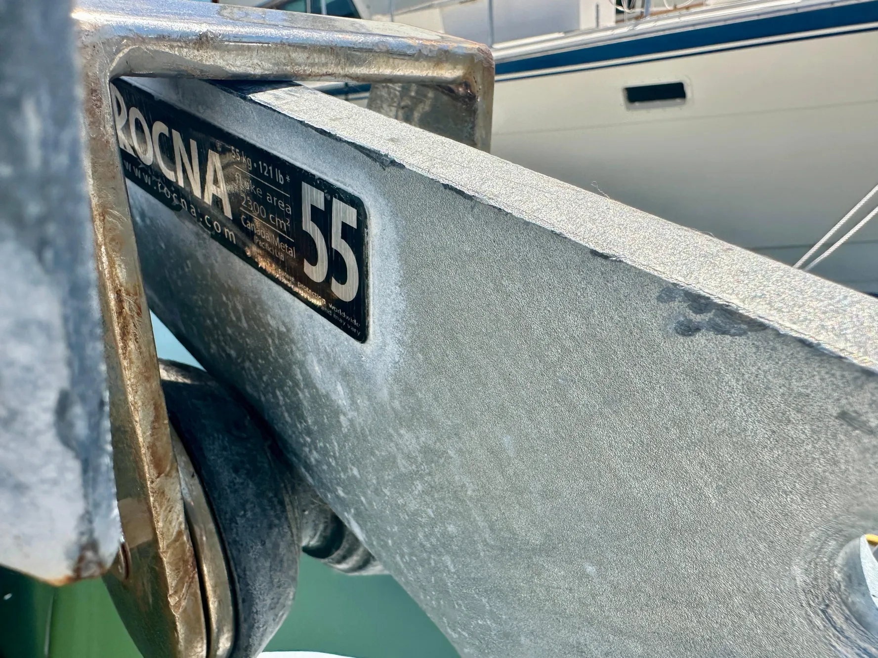 Anchor detail on a 1983 Tayana 55 sailboat, featuring Rocna 55 branding.