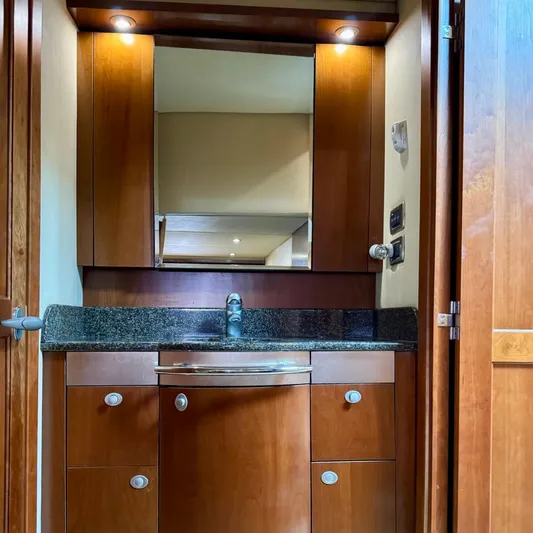 Knee Deep Yacht Photos Pics Luxurious wooden bathroom vanity in 2006 Sea Ray 48 Sundancer yacht.